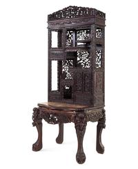A Chinese Export Carved Hardwood Displaying Cabinet and Desk