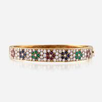 An eighteen karat gold and gem-set bangle, Van Cleef & Arpels