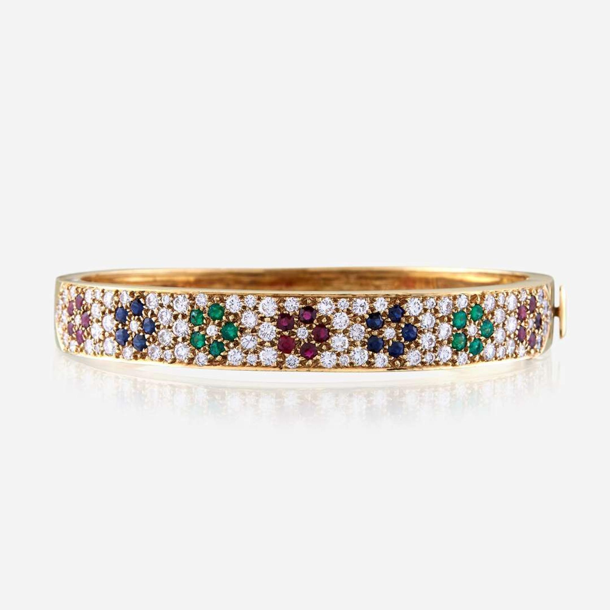 An eighteen karat gold and gem-set bangle, Van Cleef & Arpels