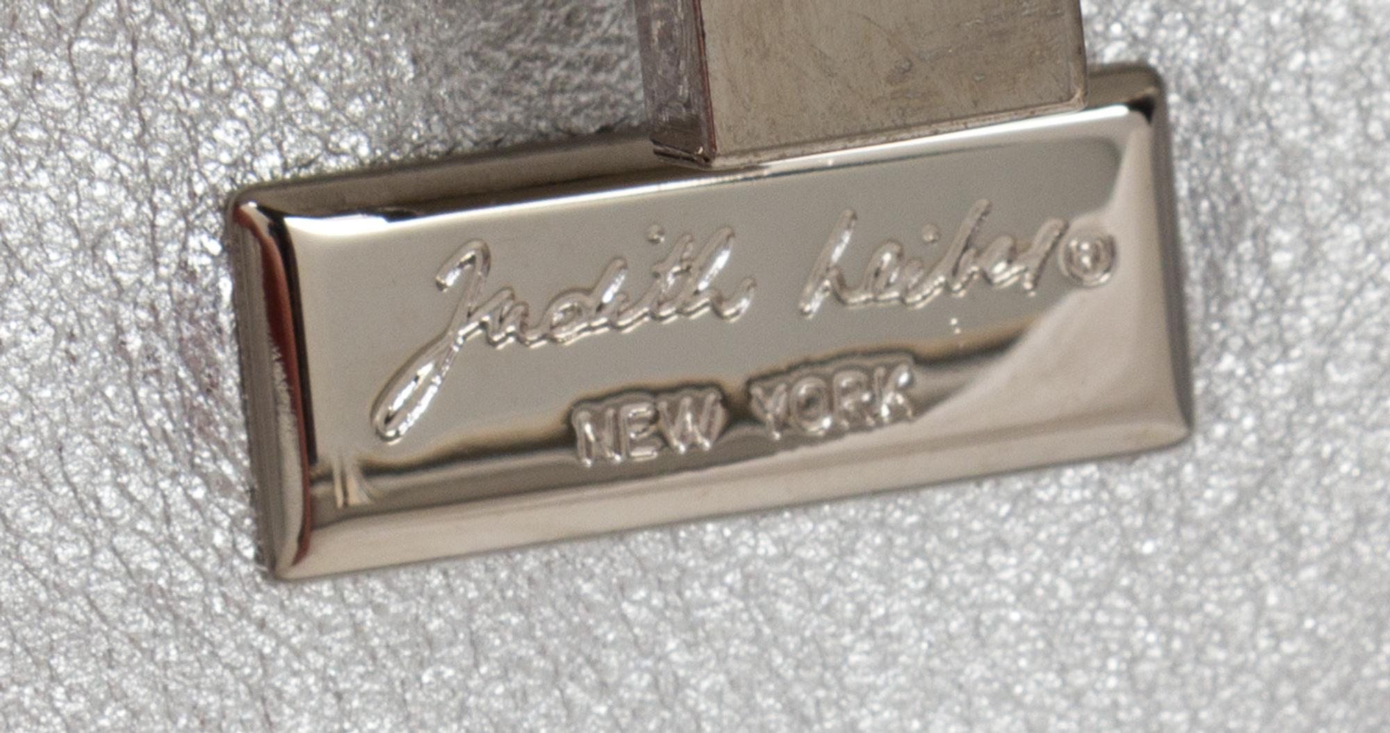 A Judith Leiber Crystal Rectangular Minaudiere, 6" x 2.5" x 1.5".