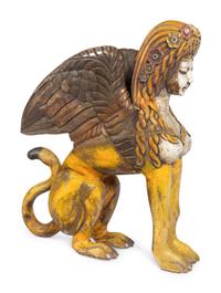 A Large Carved and Polychrome Decorated Wood Sphinx