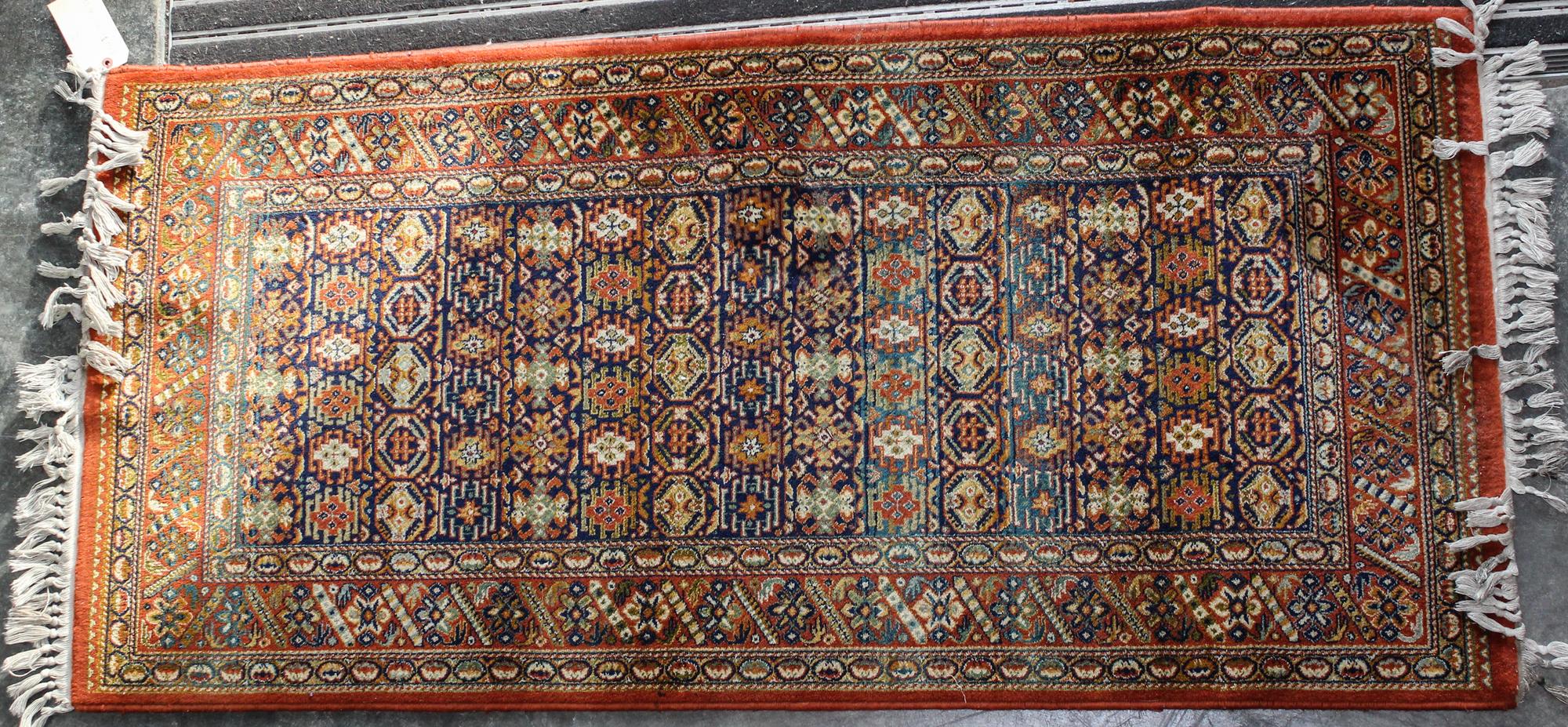 A Northwest Persian Wool Rug 62 3/4 x 30 1/2 inches.