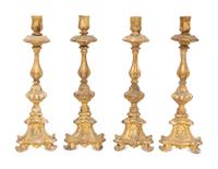 A Set of Four Italian Giltwood Candlesticks