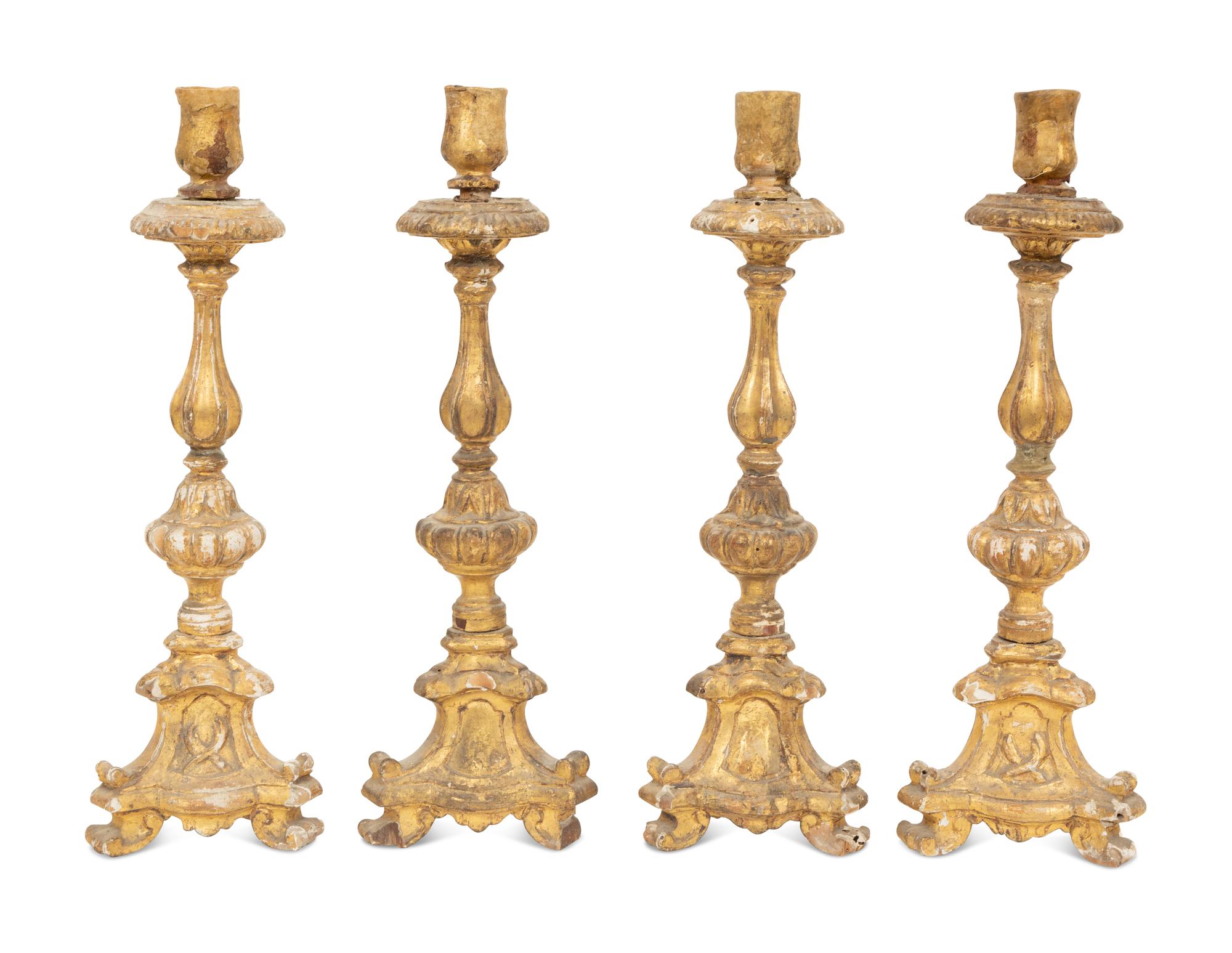 A Set of Four Italian Giltwood Candlesticks