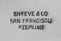 An American Silver Center Bowl, Shreve & Co., San Francisco, CA, having a shamrock decorated border and a lobed body.
