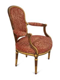 A Louis XVI Style Stained and Gilt Mahogany Fauteuil