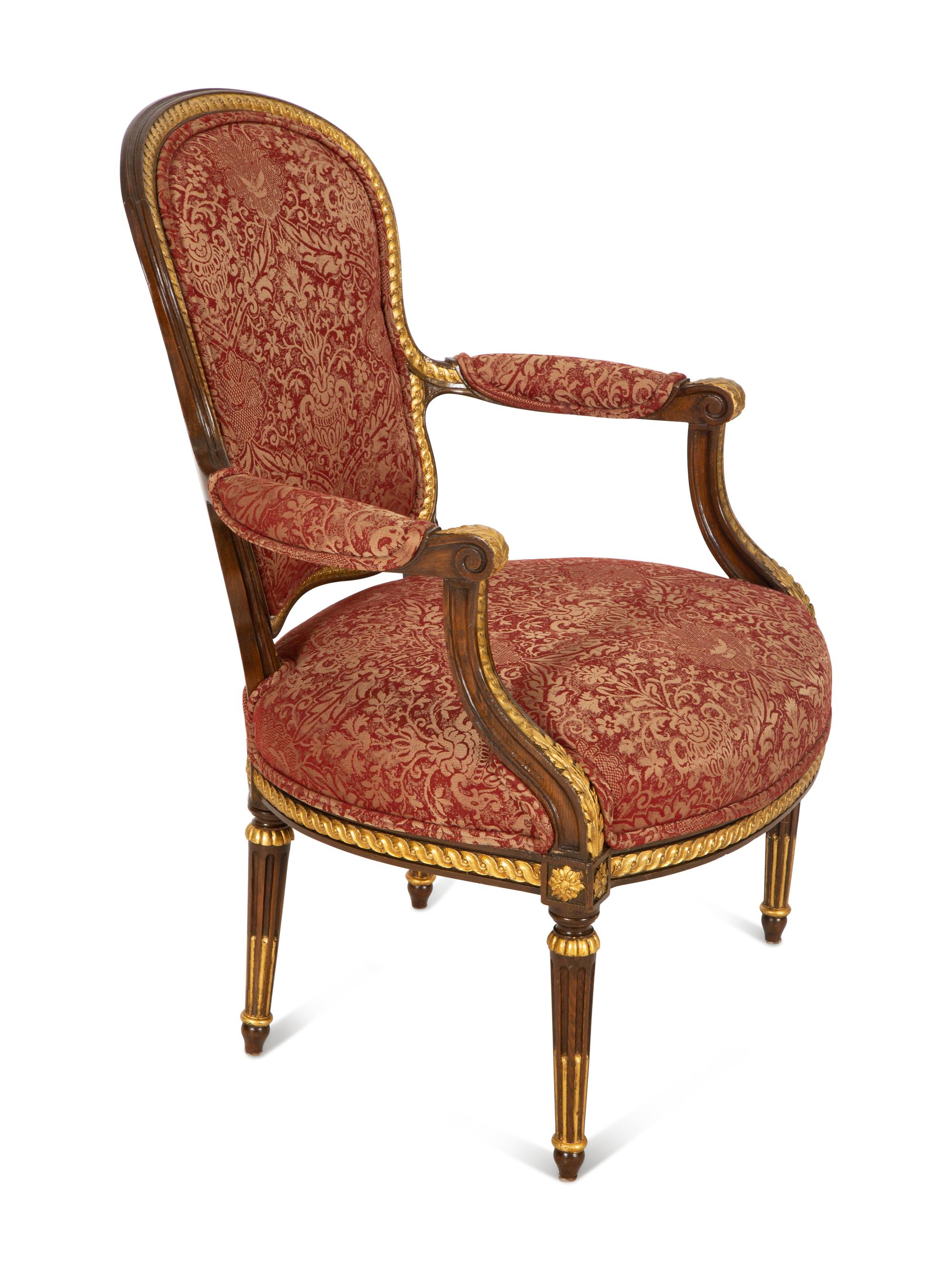 A Louis XVI Style Stained and Gilt Mahogany Fauteuil