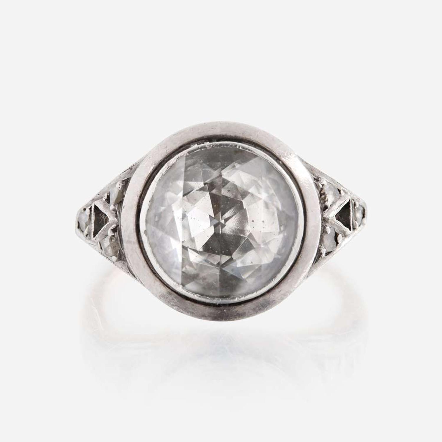 A diamond, sterling silver, and gold ring