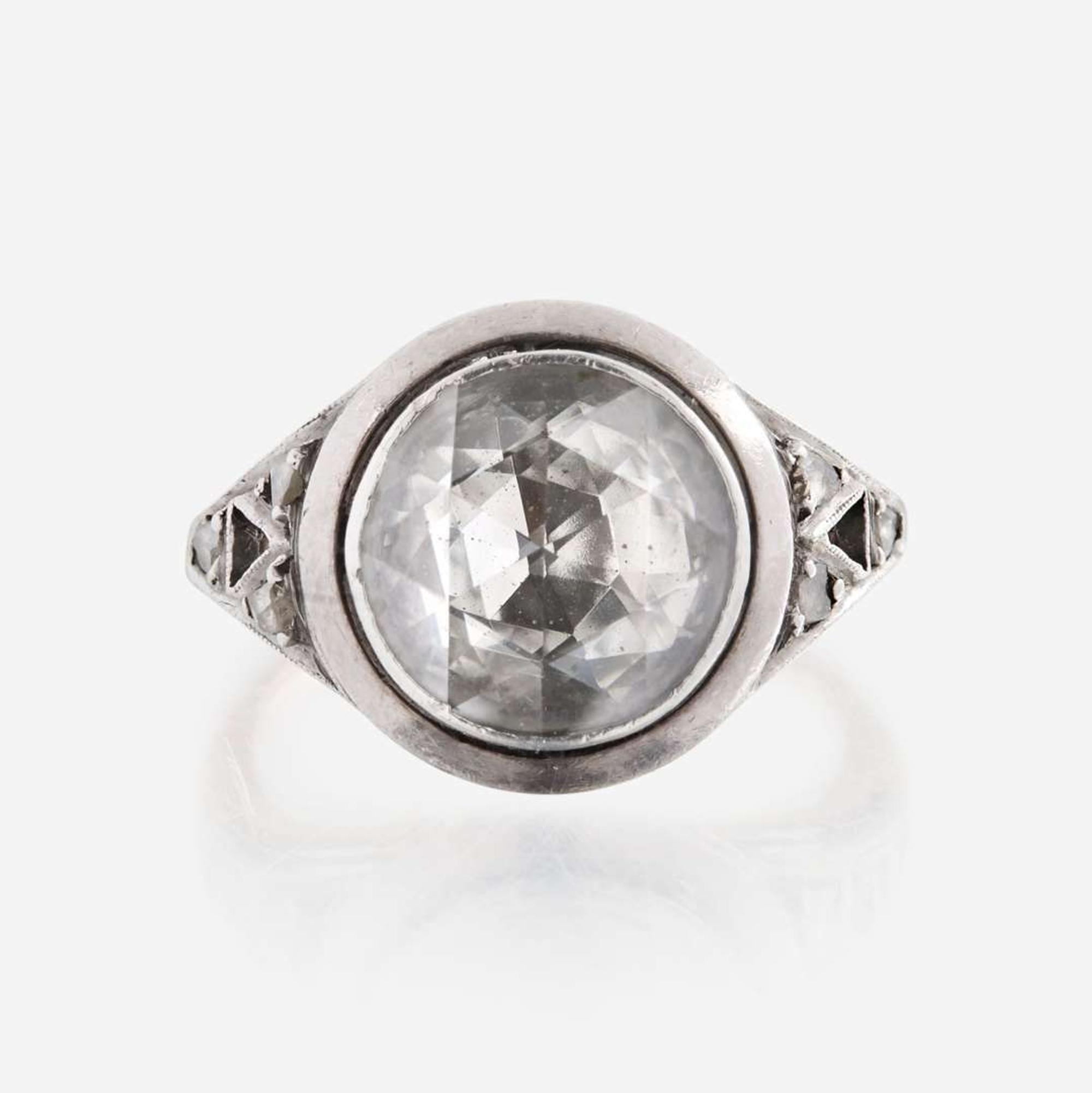 A diamond, sterling silver, and gold ring