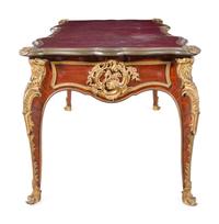 A Louis XV Style Gilt Bronze Mounted and Tooled Leather-Inset Tulipwood Bureau Plat