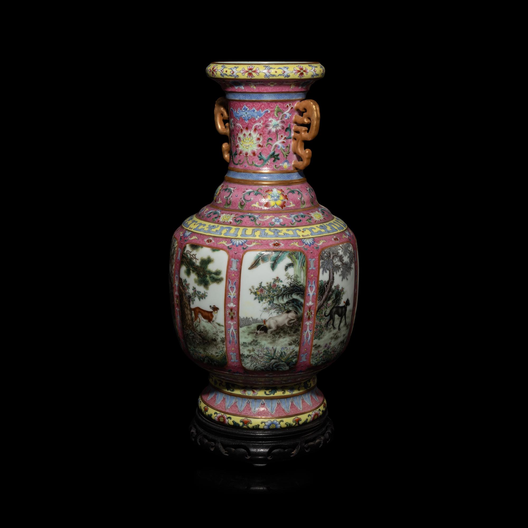 A Chinese Pink Sgraffito Ground Famille Rose Porcelain 'Dogs' Vase, Early-Mid 20th Century — 近現代 胭脂地軋道粉彩纏枝蓮紋開光獵犬圖雙耳瓶 帶木座