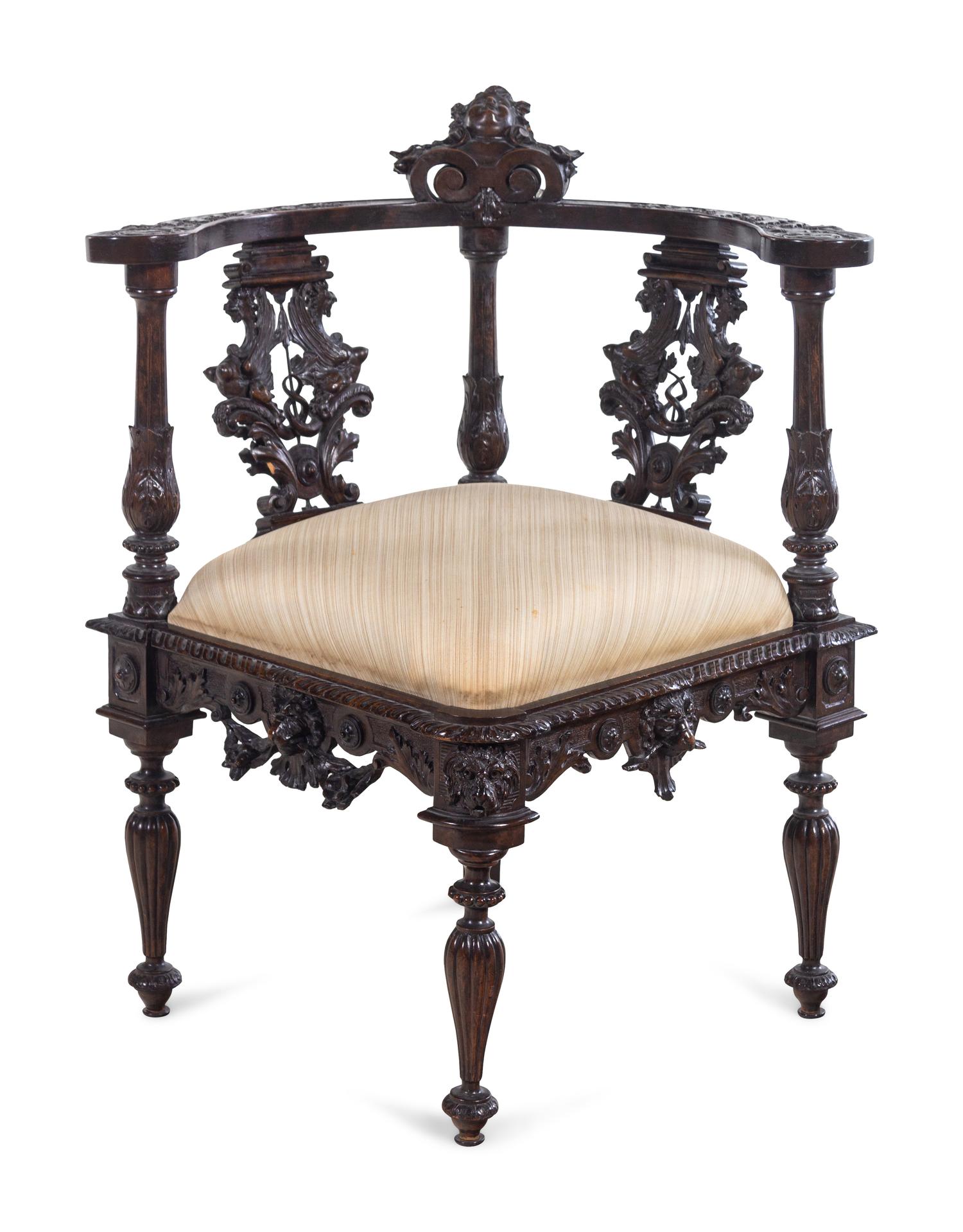 A Renaissance Revival Carved Walnut Corner Chair