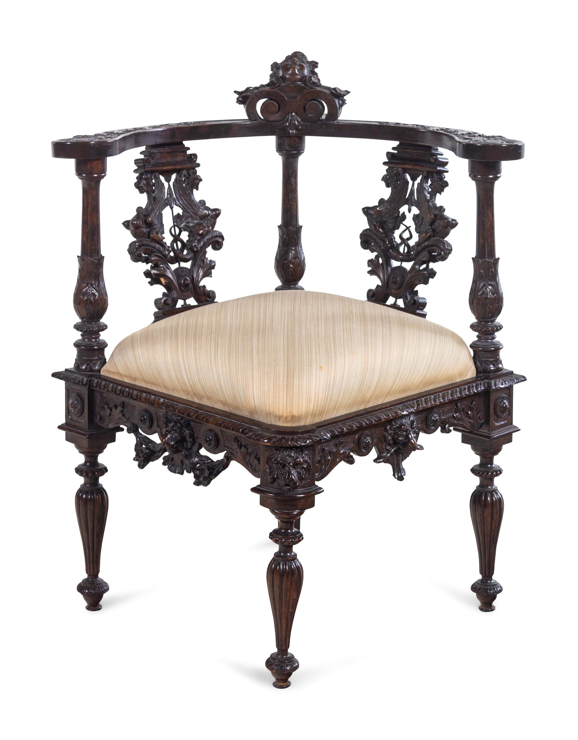 A Renaissance Revival Carved Walnut Corner Chair