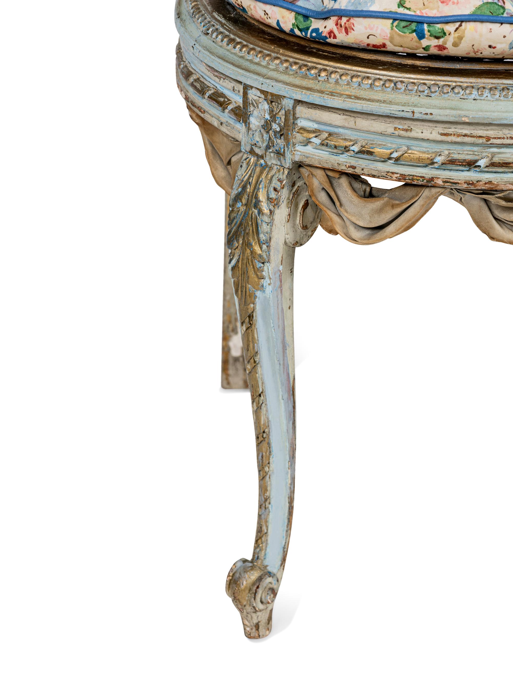 A Pair of Louis XVI Style Painted and Parcel-Gilt Chaises