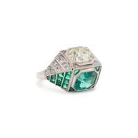 ART DECO, EMERALD AND DIAMOND SCULPTURAL 'TOI ET MOI' RING