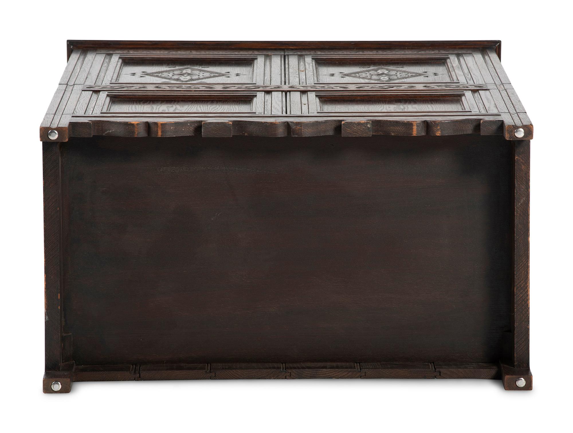 A Jacobean Style Carved Oak Cabinet