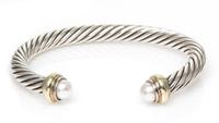 A Sterling Silver, 14 Karat Yellow Gold and Cultured Pearl 'Cable Classics' Bracelet, David Yurman, 28.70 dwts.