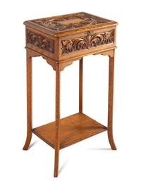 An English Carved Oak Lift Top Side Table