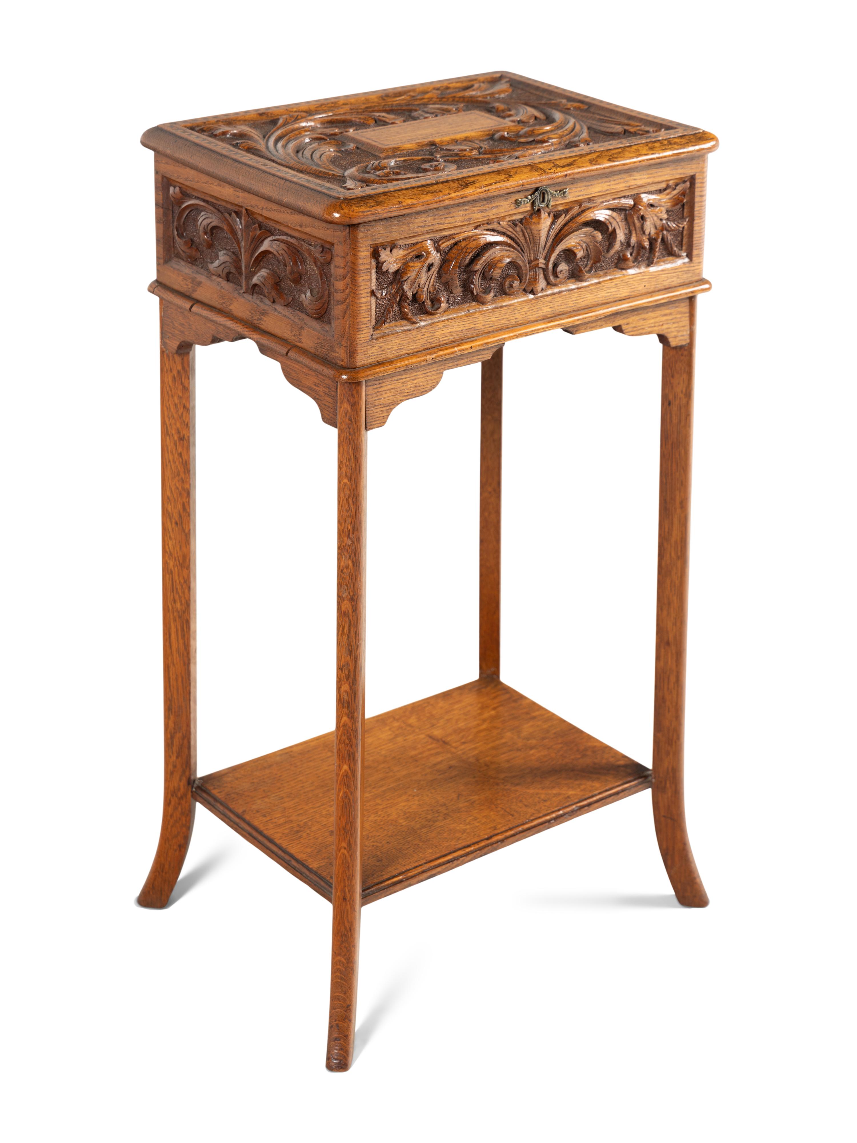 An English Carved Oak Lift Top Side Table