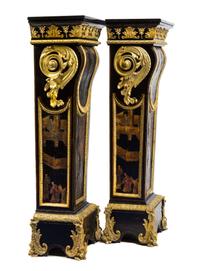 A Pair of Napoleon III Gilt Bronze Mounted and Coromandel Lacquer Inset Ebony Pedestals Height 55 1/2 x width 20 3/4 x depth 13 7/8 inc — 19TH CENTURY