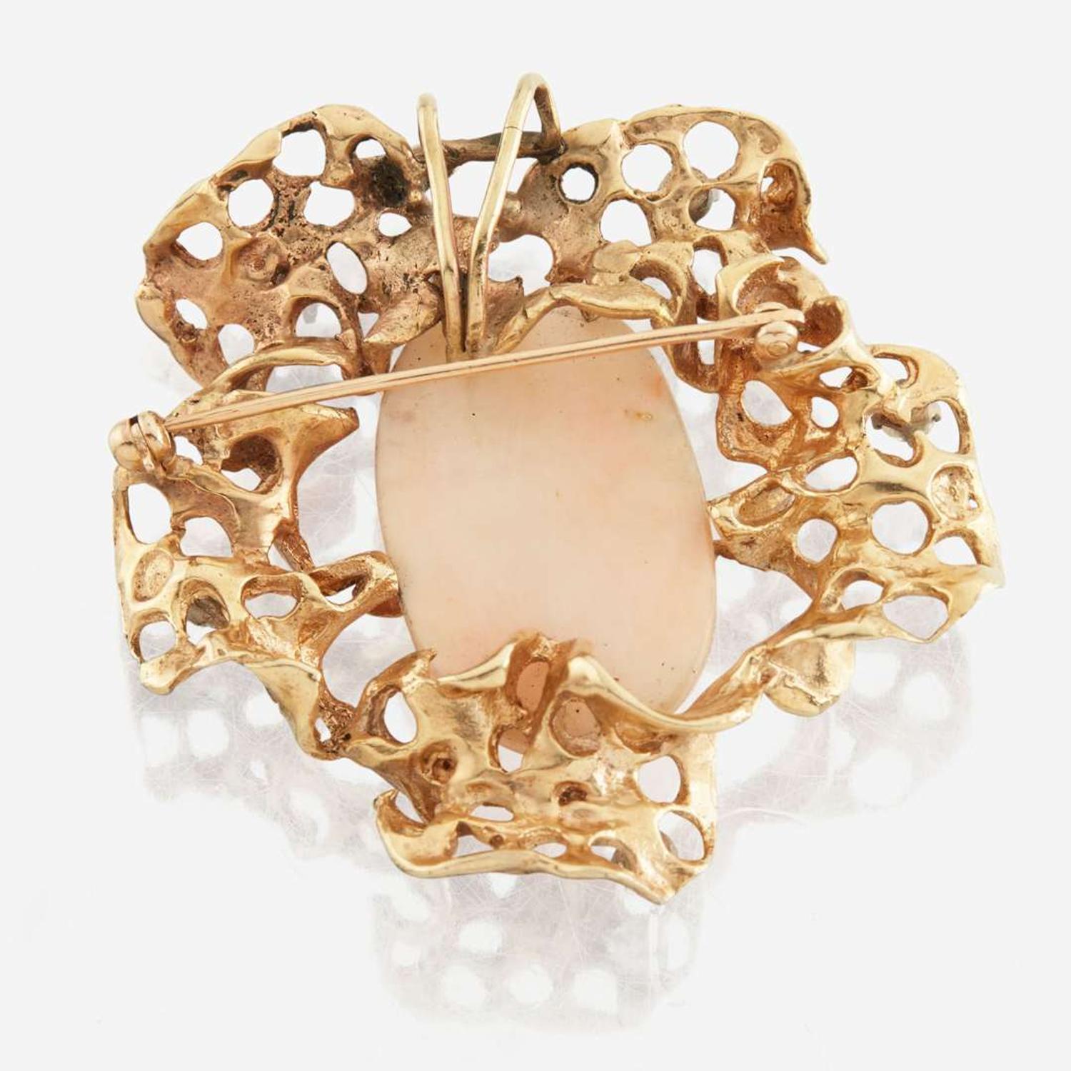 A gold, coral, and diamond pendant brooch