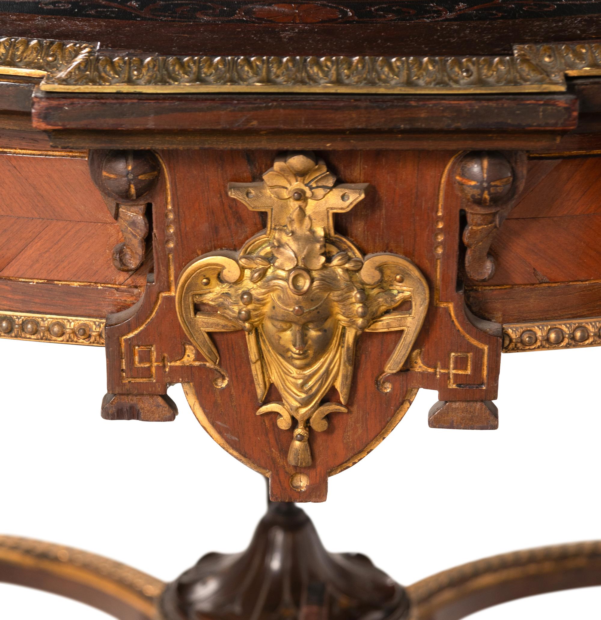 A Napoleon III Gilt Bronze Mounted Marquetry Center Table