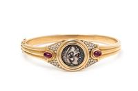 BVLGARI, YELLOW GOLD, COIN, RUBY AND DIAMOND 'MONETE' BANGLE BRACELET