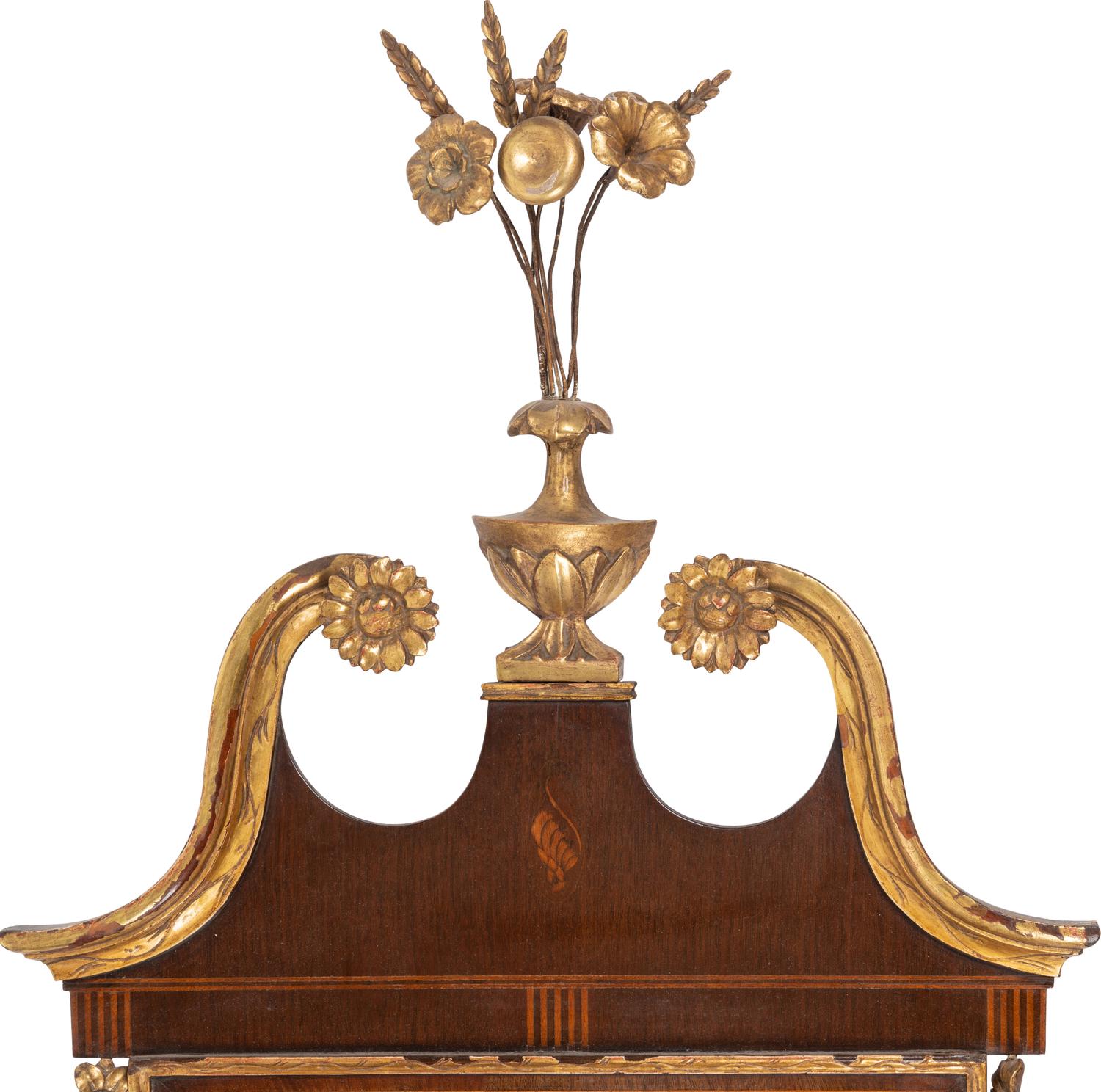 A Federal Style Parcel Gilt Mahogany and Églomisé Mirror