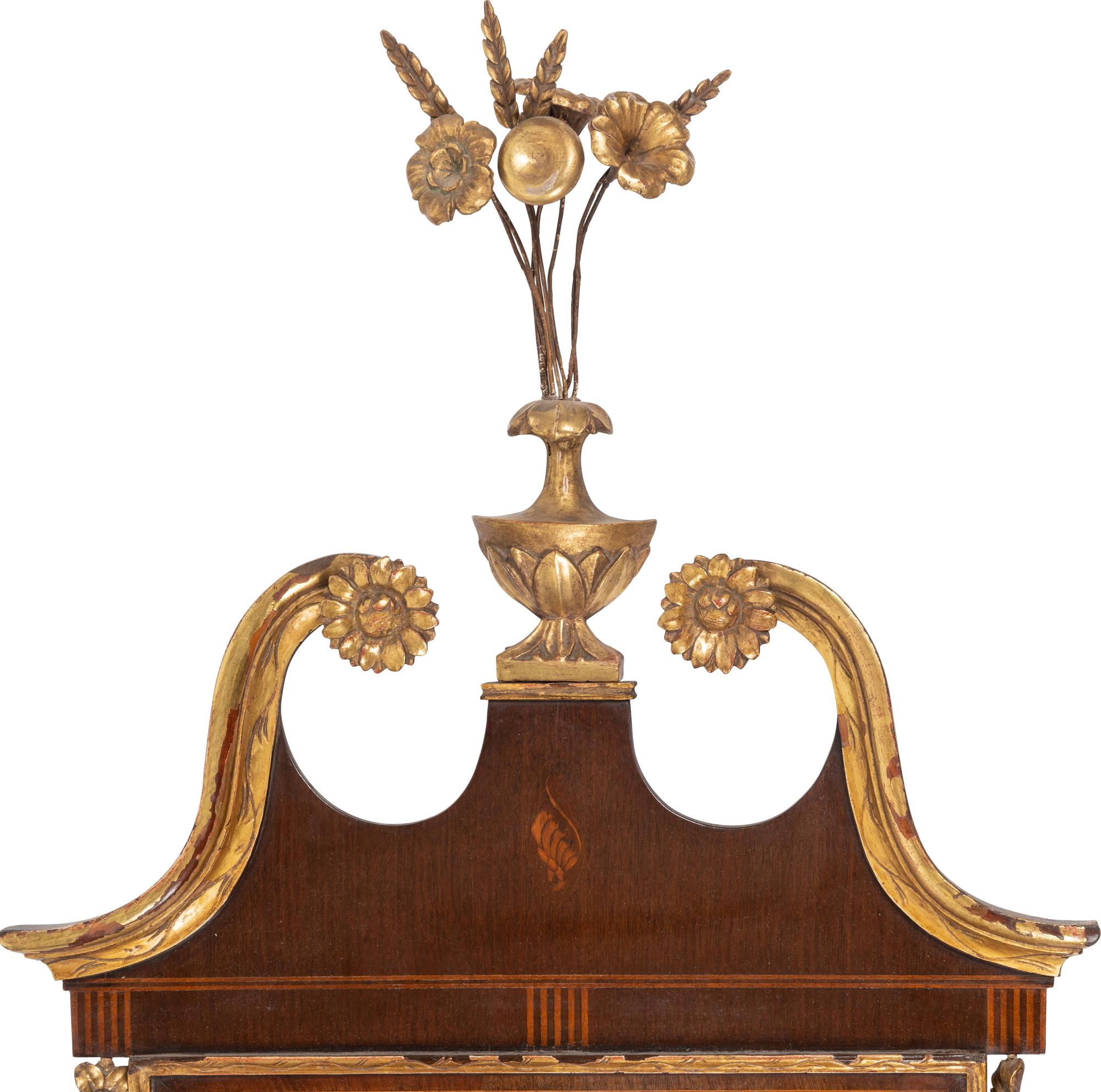 A Federal Style Parcel Gilt Mahogany and Églomisé Mirror