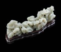 A Chinese Pale Celadon Jade ‘Lingzhi and Rockwork’ Brush Rest, 20th Century — 近代 青白玉靈芝筆架
