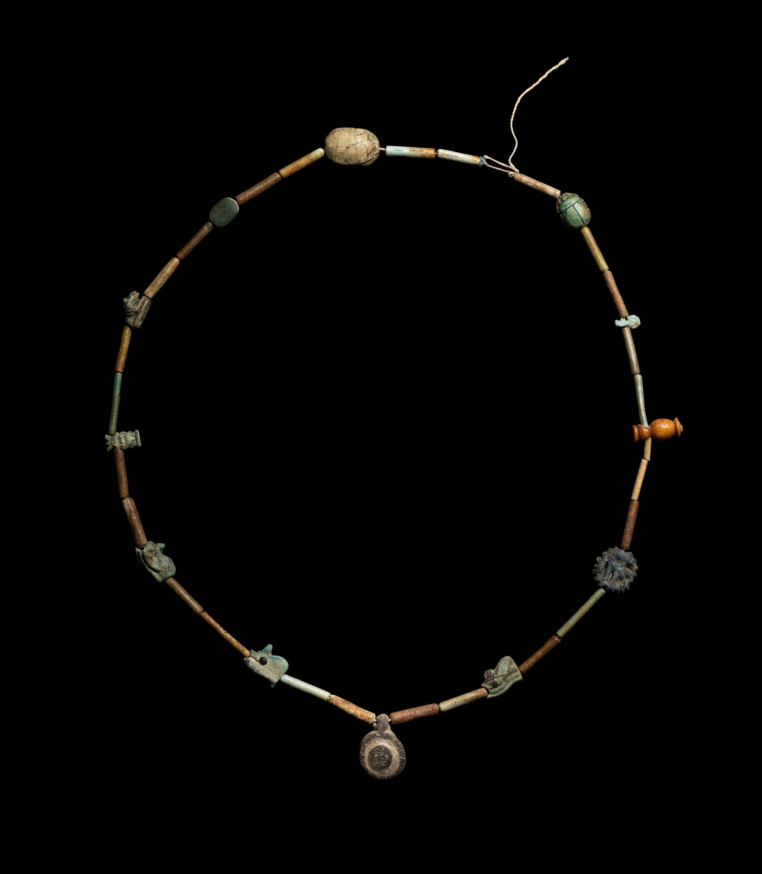 An Egyptian Faience Bead and Amulet Necklace