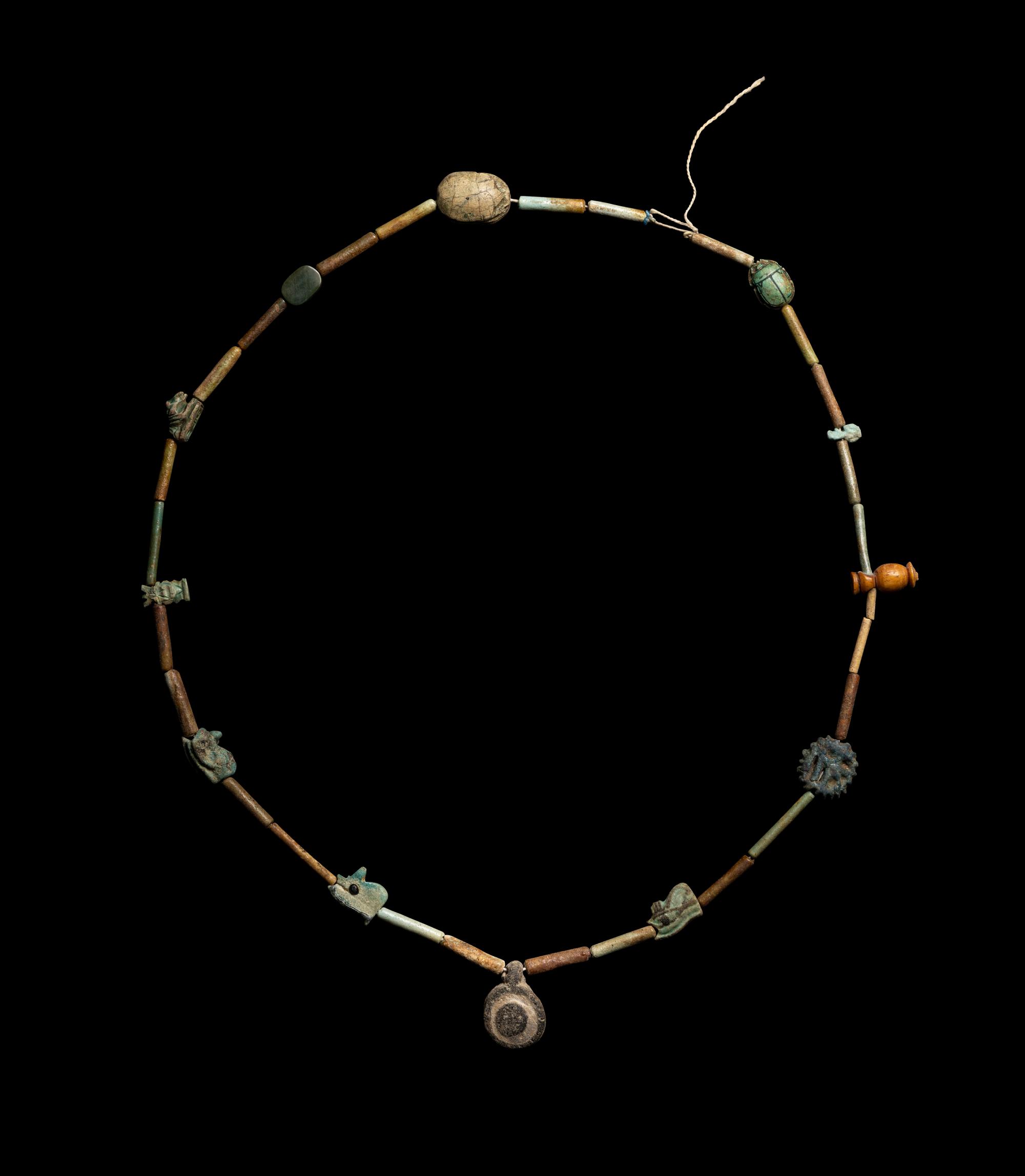 An Egyptian Faience Bead and Amulet Necklace
