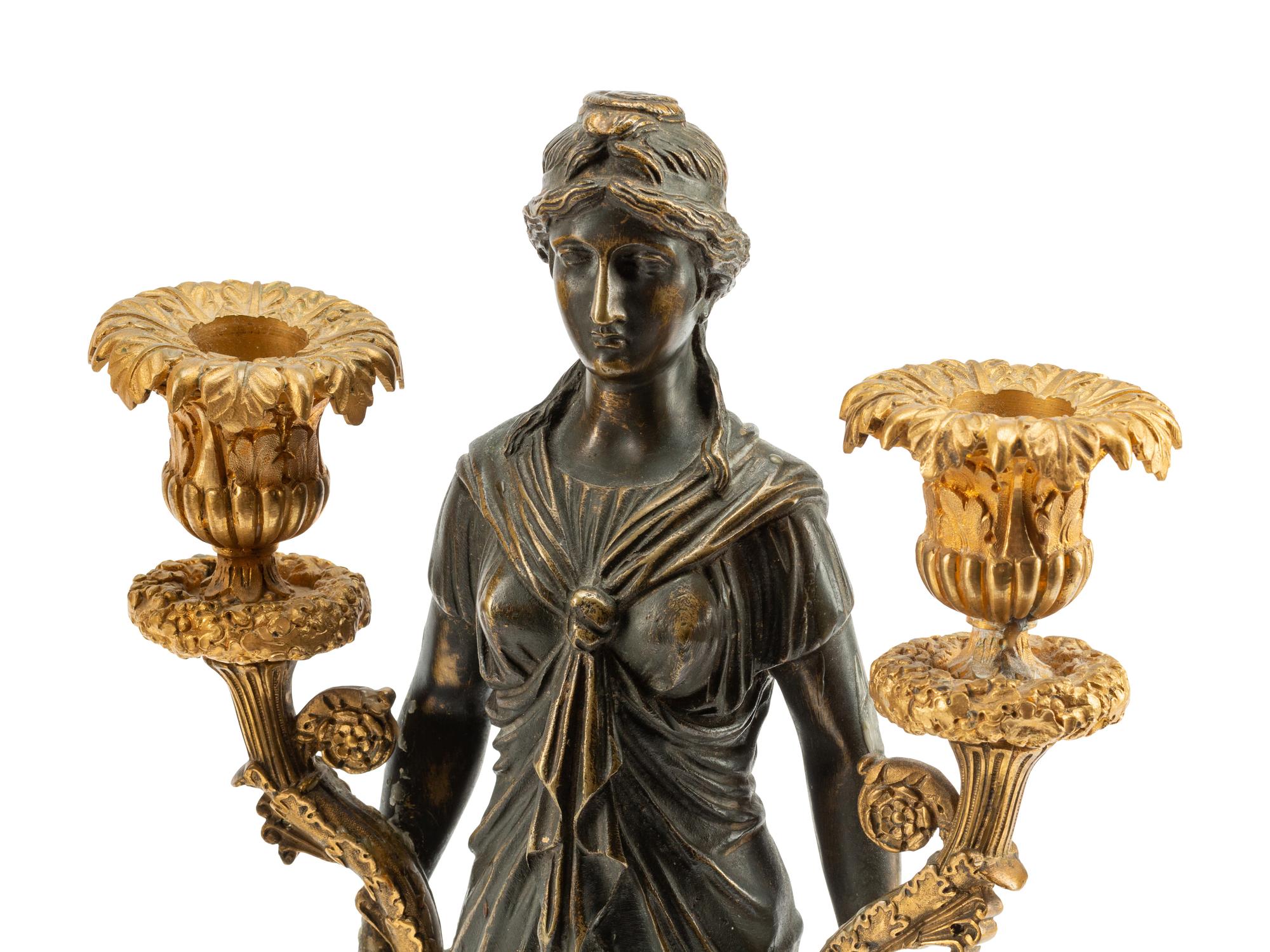 A Pair of Empire Style Gilt and Patinated Bronze Figural Two-Light Candelabra