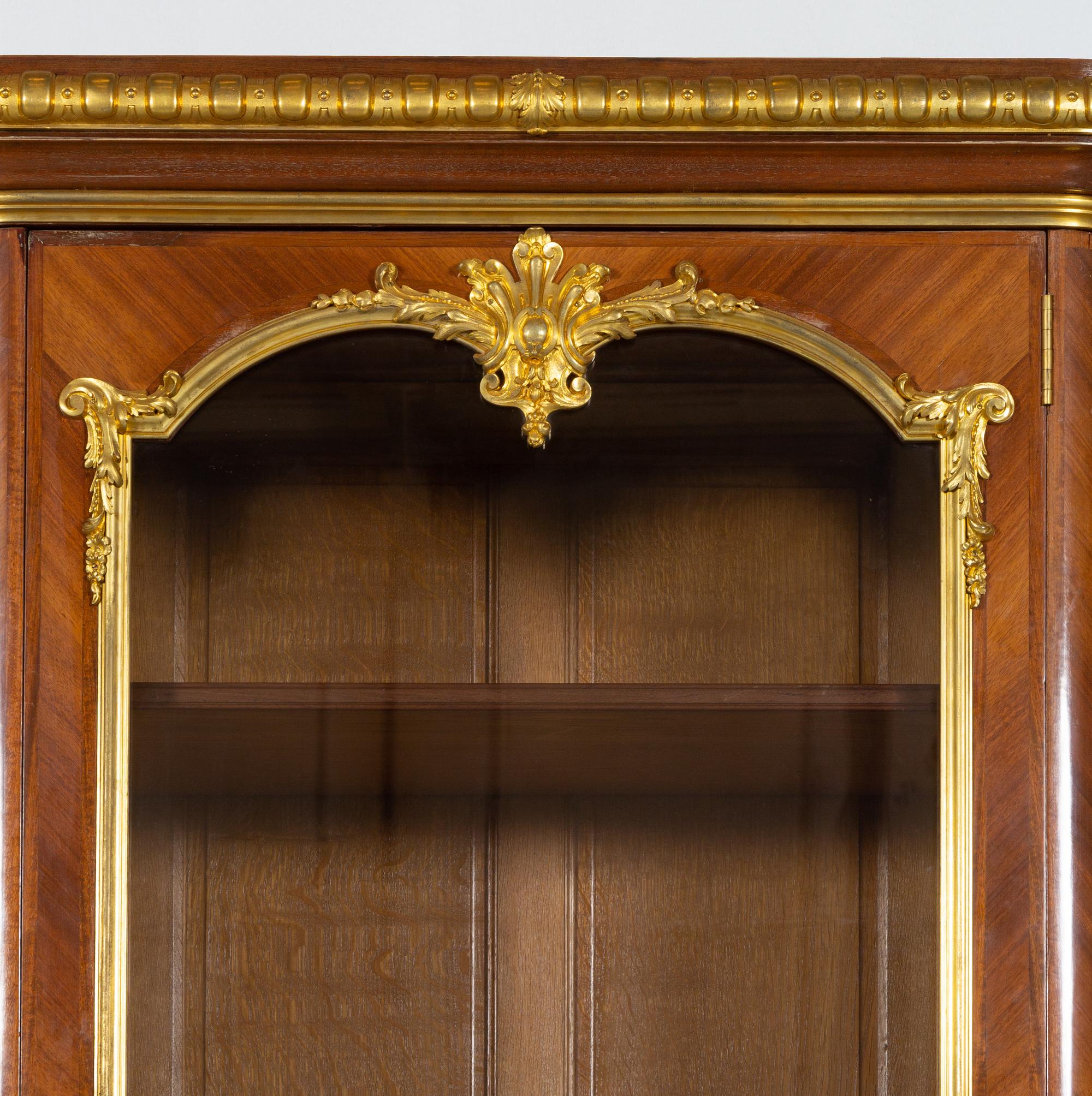 A Louis XV Style Gilt Bronze Mounted Kingwood Breakfront Cabinet