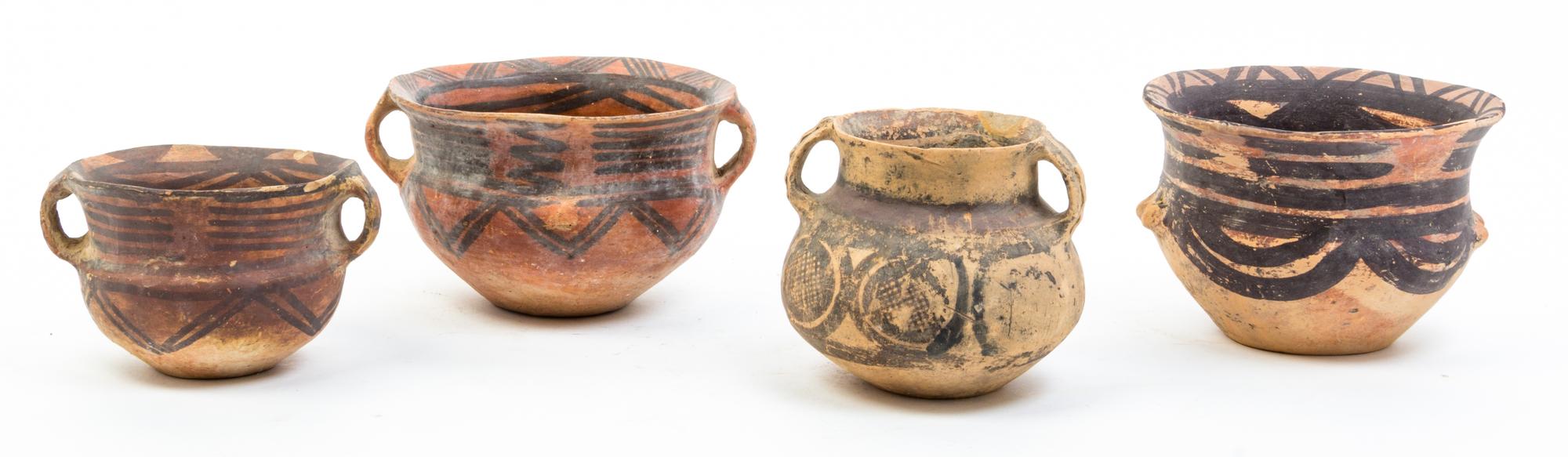 A Group of Nine Neolithic Style Pottery Vessels Height of tallest 12 inches.