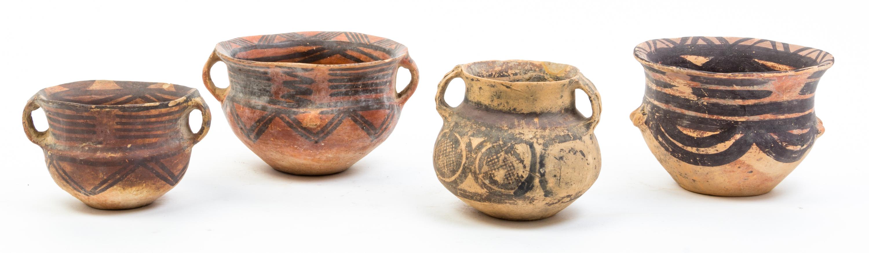 A Group of Nine Neolithic Style Pottery Vessels Height of tallest 12 inches.