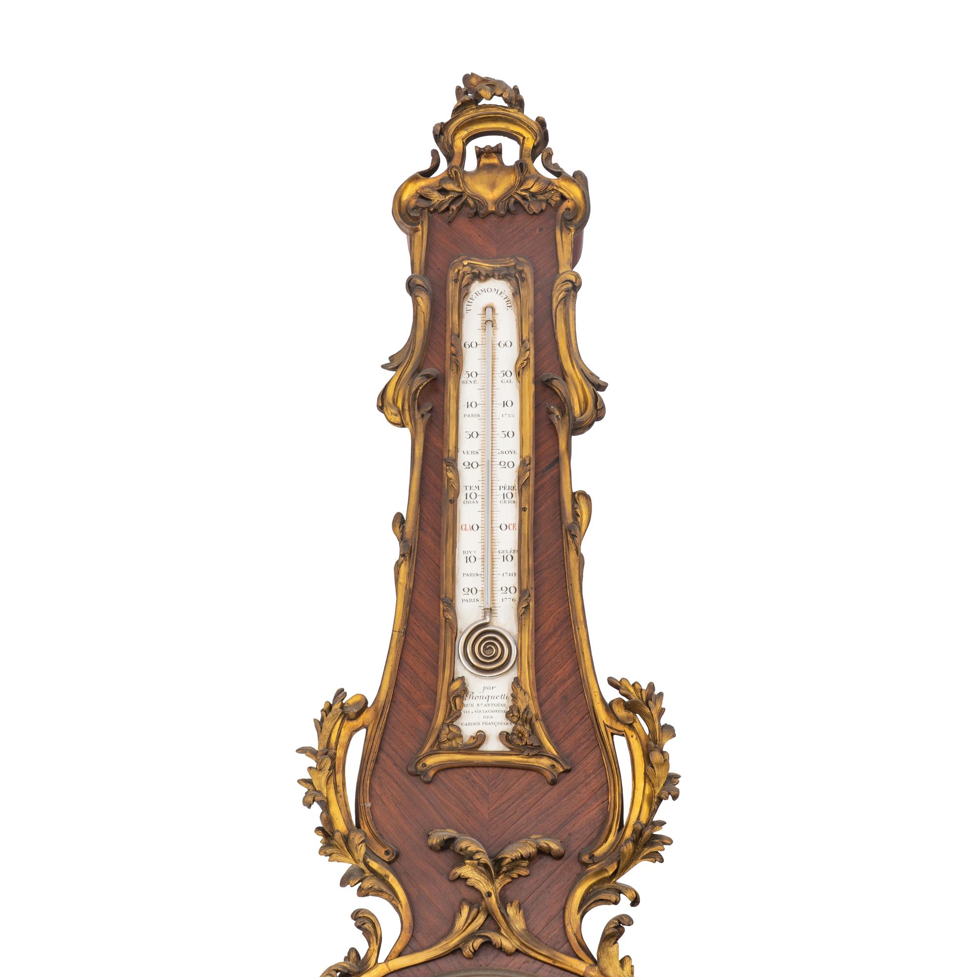 A Louis XV Style Gilt Bronze Mounted Kingwood Cartel Clock and Barometer