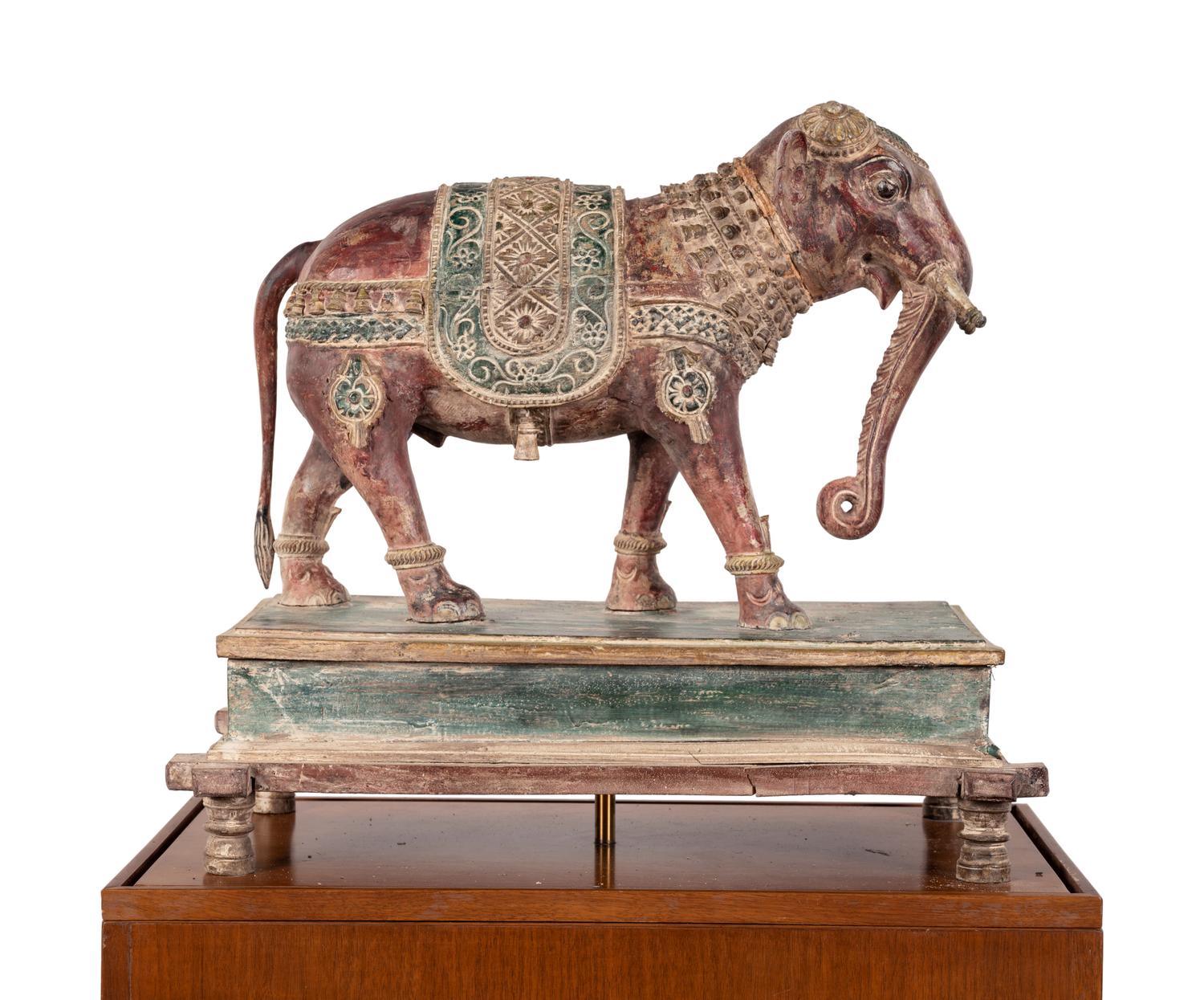 An Indian Carved Wood Model of an Elephant in a Walnut and Glass Vitrine