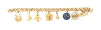 A Yellow Gold Charm Bracelet with Eight Attached Charms, 33.70 dwts.