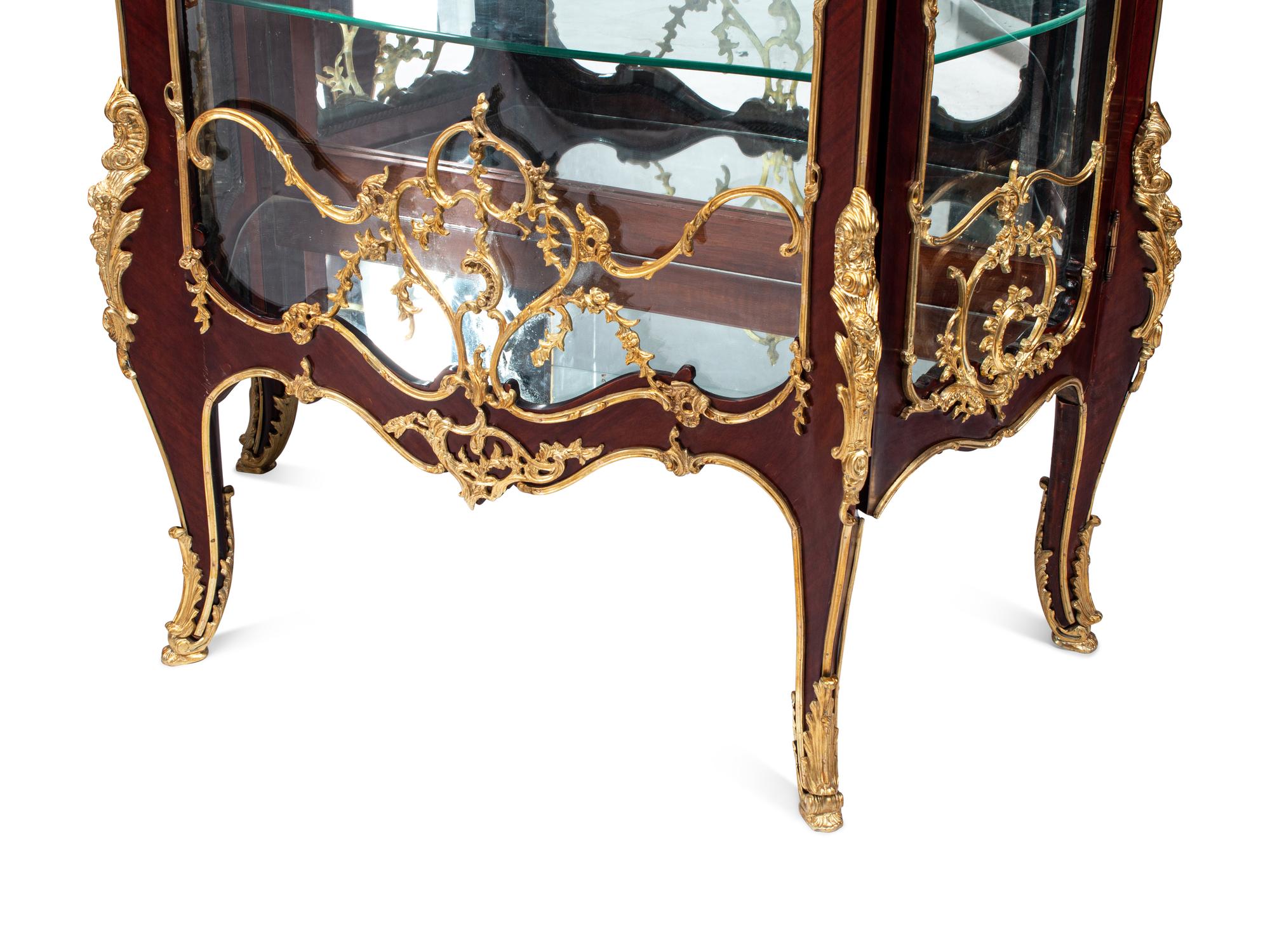 A Pair of Louis XV Style Gilt Bronze Mounted Mahogany Vitrine Cabinets