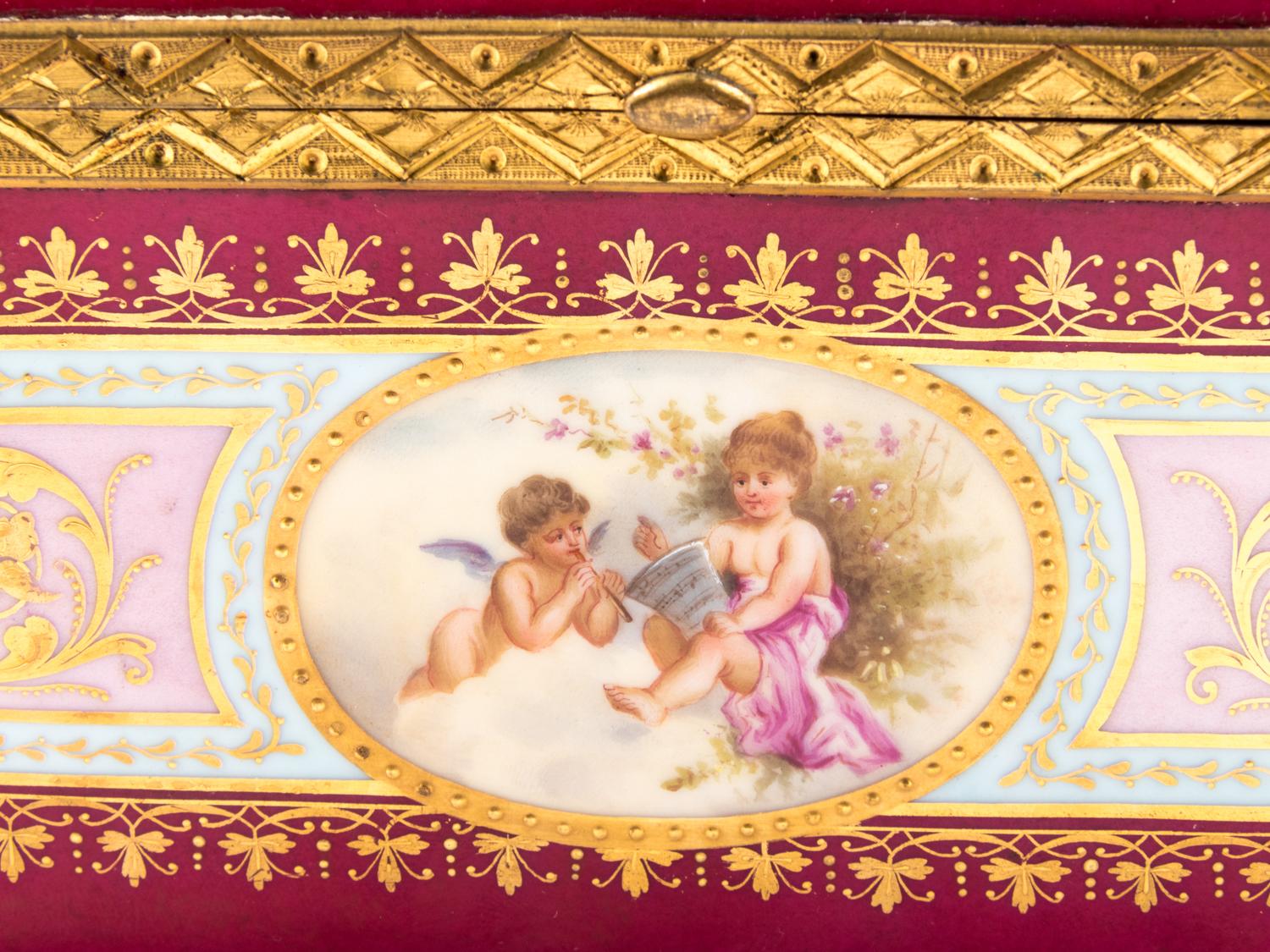 A Vienna Gilt Metal Mounted, Painted and Parcel Gilt Porcelain Table Casket