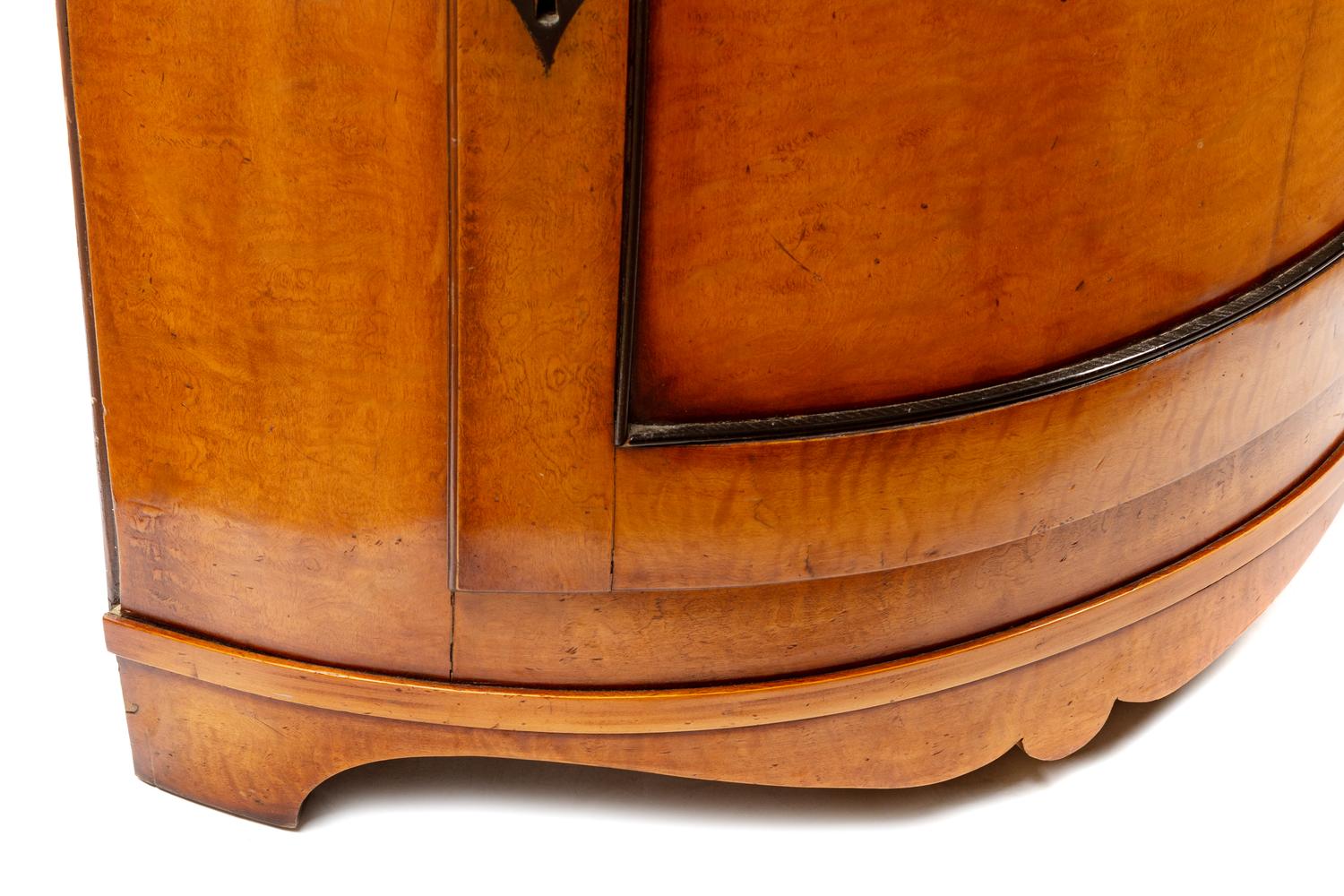 An Italian Neoclassical Part Ebonized Birch Corner Cabinet
