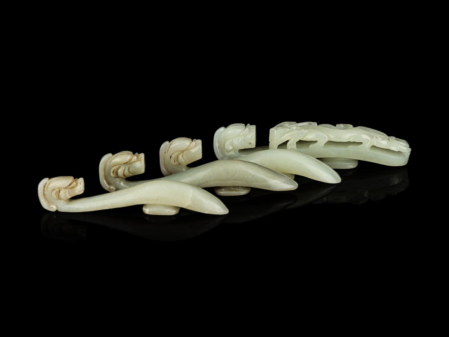 Four Chinese Celadon Jade 'Chilong' Belt Hooks