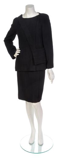 A Chanel Black Wool Boucle Skirt Suit and Bag, Jacket size 40, skirt size 40.