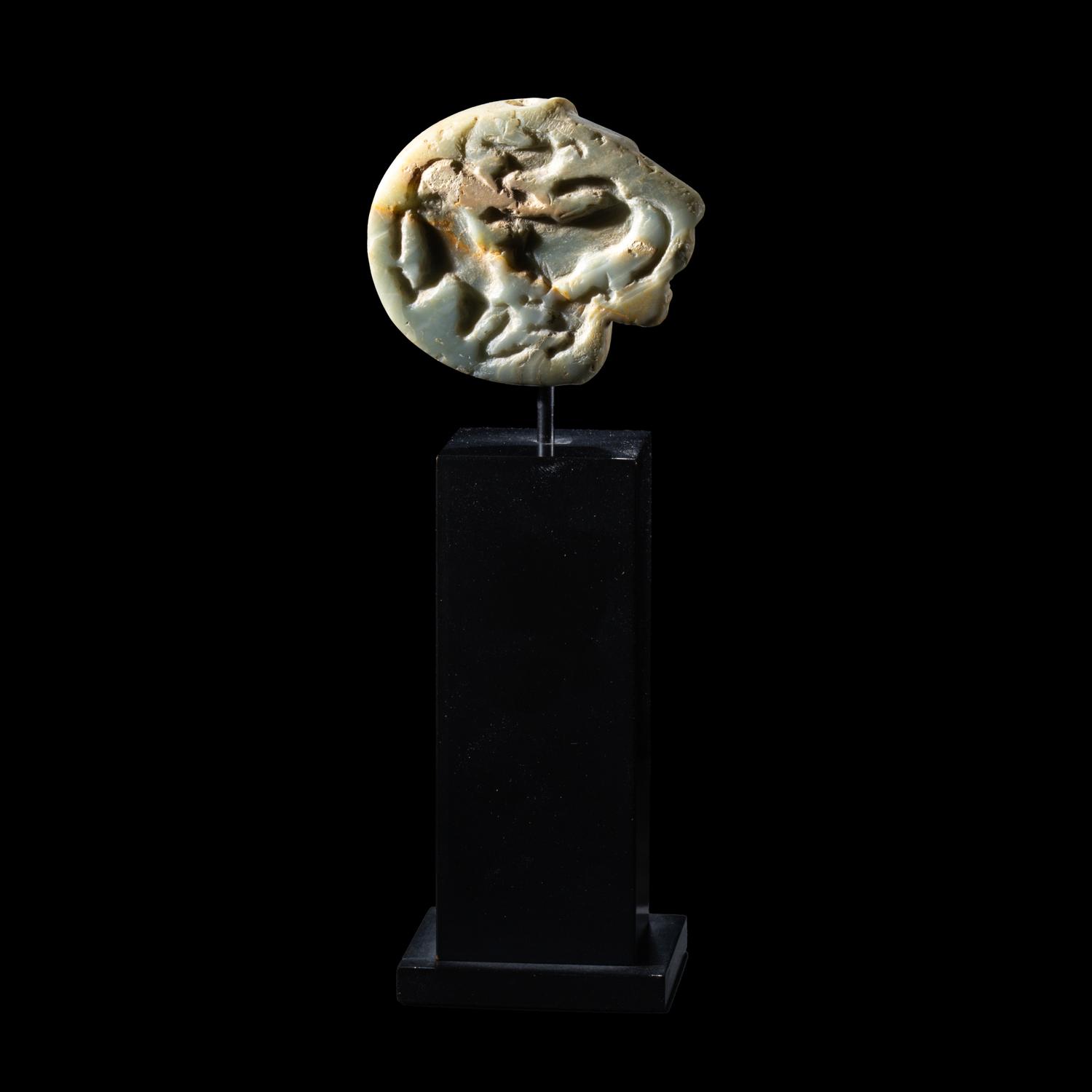 A Mesopotamian Green Stone Seal with a Lion Head