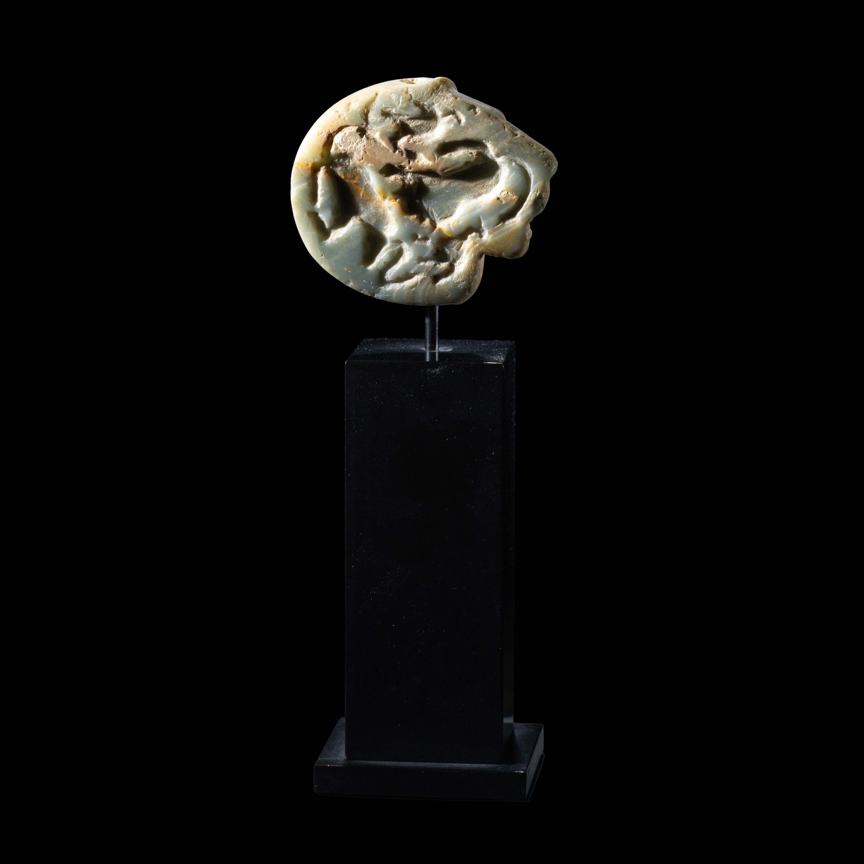 A Mesopotamian Green Stone Seal with a Lion Head