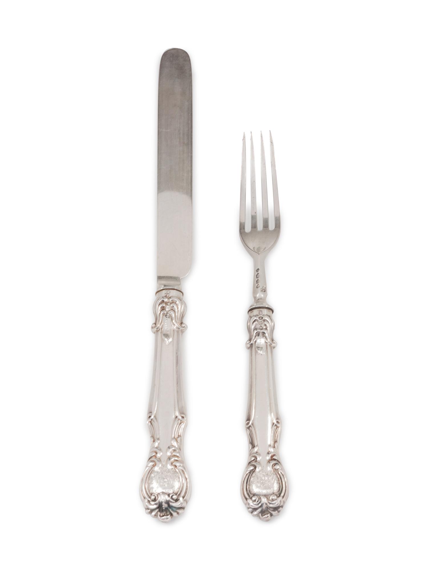 comprising: 12 forks 13 knives with stainless steel blades 25 items total.