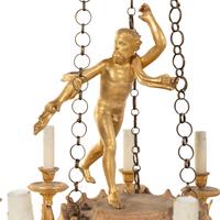 An Empire Giltwood Twelve-Light Chandelier