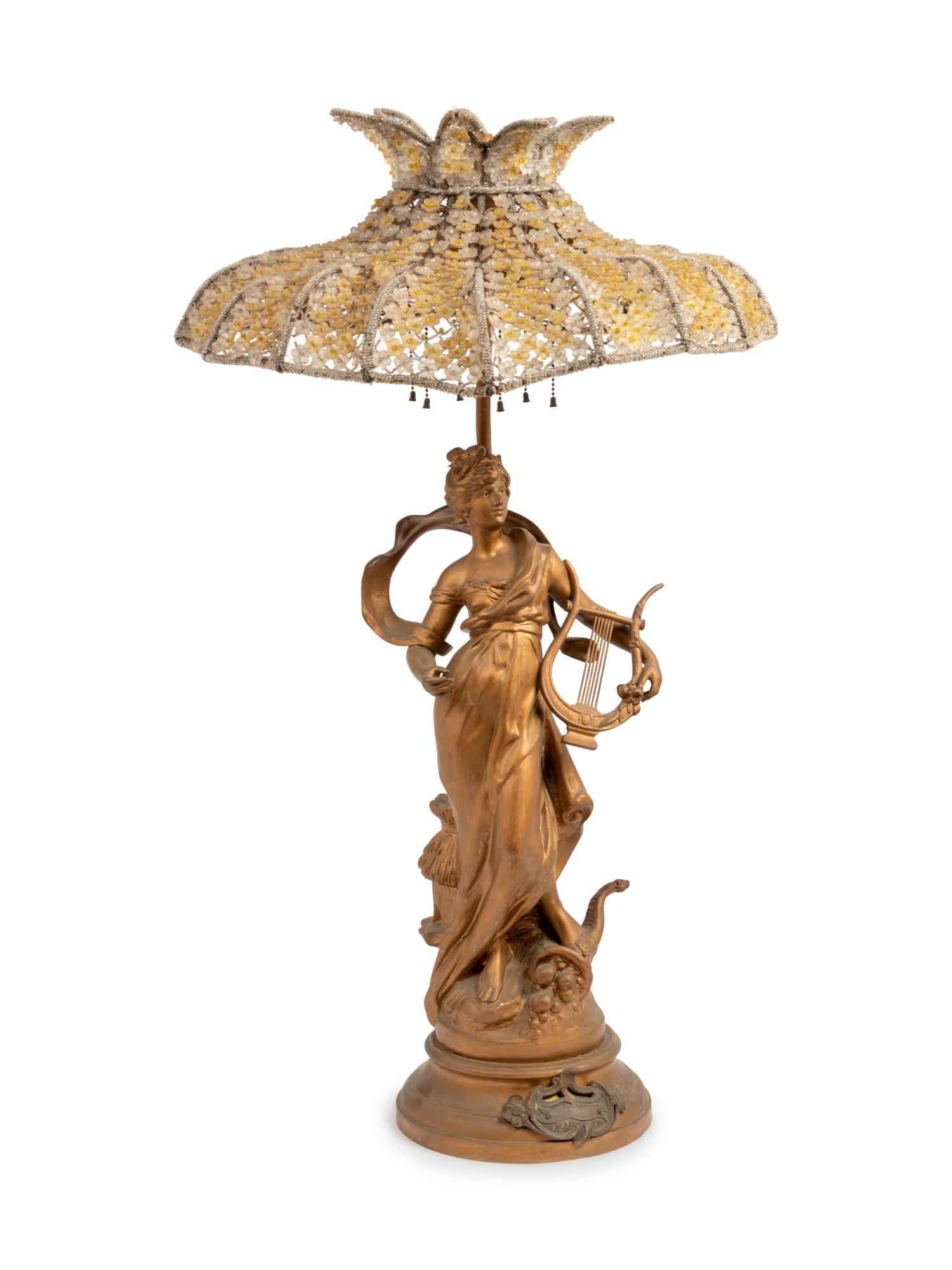 A French Cast Metal Figure after Louis Moreau, Mounted as a Lamp with a Beaded Shade