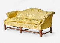 A Chippendale style mahogany camelback sofa with yellow silk damask upholstery, 20th century